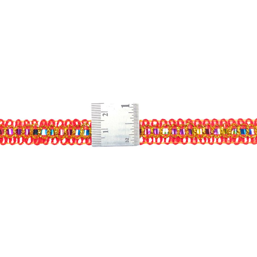 Multicolored beaded bracelet with a ruler for scale on a white background